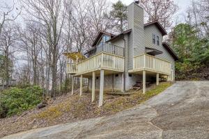 a house on the side of a dirt road at Renovated Chalet-pool-hot Tub-fireplace-sauna in Gatlinburg