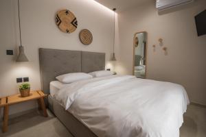 Postel nebo postele na pokoji v ubytování Palaia Luxury Suite