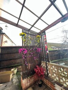 a balcony with flowers on a fence at Newtons Lodge in Nottingham