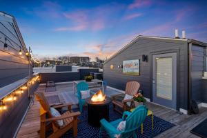 a tiny house with a fire pit on a deck at Dolly PartyOn - Downtown Views - Rooftop - Groups in Nashville