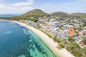 an aerial view of a beach with an orange marker at Fleetwood 3 63 Shoal Bay Road Relaxed living with water views overlooking Shoal Bay in Shoal Bay