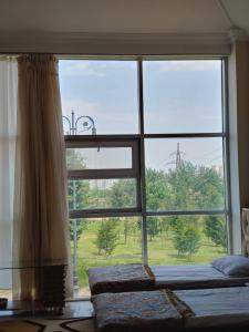 a large window with a view of a field at Lahore Hotel Baku in Baku