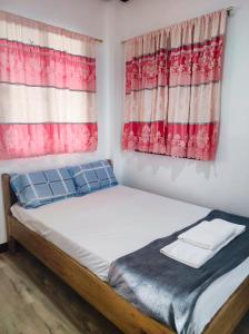 Postel nebo postele na pokoji v ubytování Hidden Gem Siargao