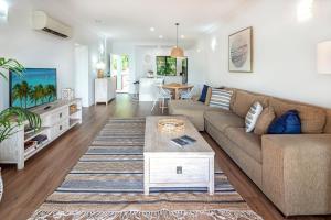 A seating area at Haven on Hamilton Island -private apartment with views & buggy Fully Renovated in 2023