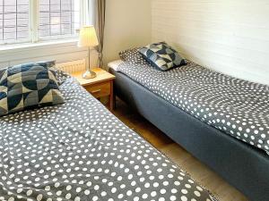 Katil atau katil-katil dalam bilik di Holiday home BÅSTAD II