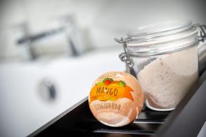 a wooden spoon and a jar of rice on a stove at Kings Arms Suites - Luxury Double - Freestanding Bath - Self Check In in Whitehaven