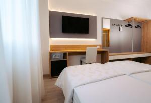 Postel nebo postele na pokoji v ubytování Hotel Everest
