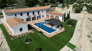 an aerial view of a house with a swimming pool at Villa con piscina privada - Benimarraig in Benissa
