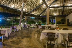 a banquet hall with white tables and chairs at Isla Tajín in Tuxpan de Rodríguez Cano