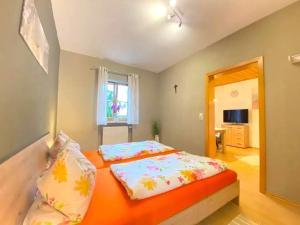 a bedroom with a bed with pillows on it at Comfortable apartment in Zenting in Lower Bavaria in Zenting