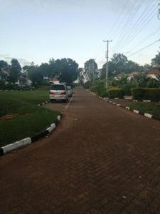 a car parked on the side of a brick road at De Gold Nest-opposite USA Embassy (entire condo) in Nairobi +16 photos