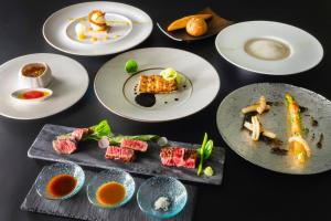 a group of plates of food on a table at ANA InterContinental Appi Kogen Resort, an IHG Hotel in Hachimantai