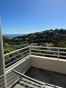 a balcony with a view of the ocean at 22 Lands End in Ballito