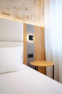 Postel nebo postele na pokoji v ubytování Hotel Everest
