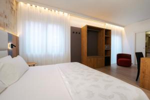 Postel nebo postele na pokoji v ubytování Hotel Everest