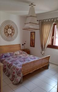 a bedroom with a large bed in a room at Casa Vacanze Chiara in Olbia