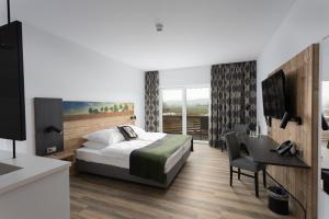 Postel nebo postele na pokoji v ubytování Hotel Grohnder Fährhaus + 37 fotografií