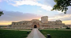 a large castle with a pathway leading to it at Arcipreste in Zamora