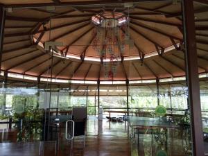 a large building with a large ceiling with a chandelier at Discovery Village Resorts in Begūr