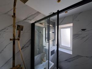 a bathroom with a white sink and a mirror at Pokoje Gościnne u Marysi in Nowy Sącz