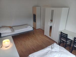 Postel nebo postele na pokoji v ubytování Hevals Budget Apartments