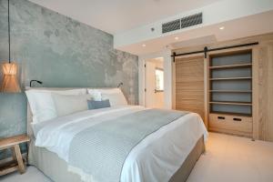 Ein Bett oder Betten in einem Zimmer der Unterkunft Blu Mare Hotel