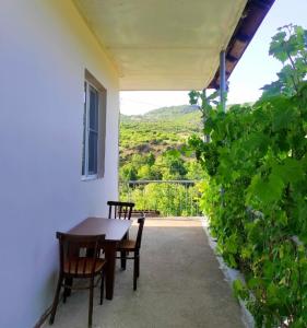 a table and chairs on a patio with a view at MD Guest House in Getahovit