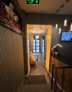 a hallway leading to a living room with a stairway at The Aramis Galata Hotel in Istanbul
