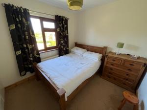 Postel nebo postele na pokoji v ubytování Runclevin House