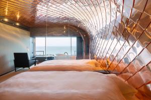 Ένα ή περισσότερα κρεβάτια σε δωμάτιο στο Kameya Hotel