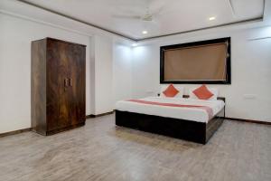Krevet ili kreveti u jedinici u objektu OYO Flagship Hotel Nirvana