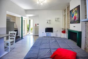 a bedroom with a large bed in the middle of a room at La Casa dei Laghi 2 Comabbio Monate Maggiore Orta in Mercallo