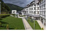 an external view of a building with a green lawn at Serendipity Apartment in Brzeće