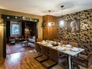 a dining room with a table and chairs at Large detached holiday home in Willingen with garden in Willingen