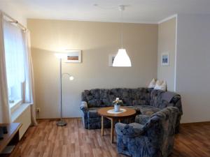 a living room with a couch and a table at Spacious Apartment in Wohlenberg Germany with Beach Near in Wohlenberg