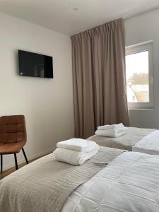 Ein Bett oder Betten in einem Zimmer der Unterkunft Hotell By Bostadsagenturen
