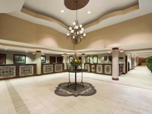 a lobby of a hotel with a chandelier at Buena Vista Suites Orlando in Orlando +29 photos