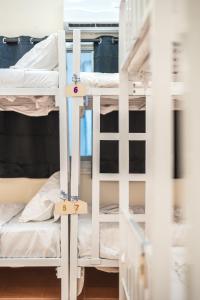 a room with bunk beds in a dorm room at Beds Friends Phi Phi Hostel in Phi Phi Islands