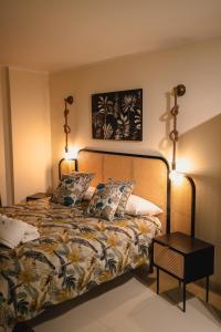 a bedroom with a bed with two lamps on it at Vinto House Salerno Downtown in Salerno