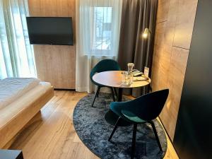 Una cama o camas en una habitación de Sonne 1806 - Hotel am Campus Dornbirn