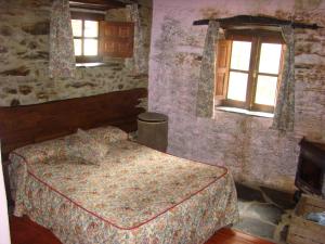 Postel nebo postele na pokoji v ubytování Casa Rural La Ortiga