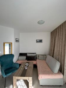 a living room with a couch and a table at Apartment Nadja in Budva