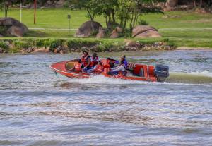a group of people on a boat in the water at Stephen Margolis Resort in Harare