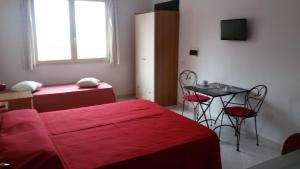 A bed or beds in a room at Ca'Mea