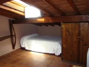 Postel nebo postele na pokoji v ubytování Casa Rural La Ortiga