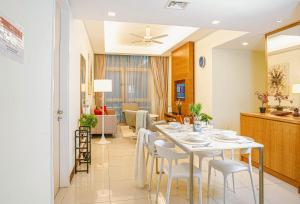 a dining room and living room with a table and chairs at 400m to KLCC Bukit Bintang Pavillion KLCC LRT walking distance Lot 163 Zenglo in Kuala Lumpur