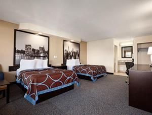 A bed or beds in a room at Super 8 by Wyndham Rahway/Newark