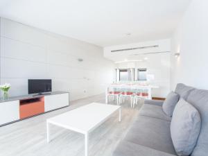 a living room with a couch and a table at Aixa - House In Marina Manresa Free Wifi in Alcudia
