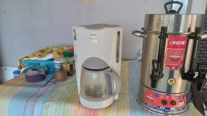 a blender sitting on a counter next to a coffee maker at Kardelen Camping in Mugla