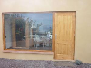 a sliding glass door to a dining room with a table at Holiday home Finca Comfortable Vacation Home in Icod de los Vinos